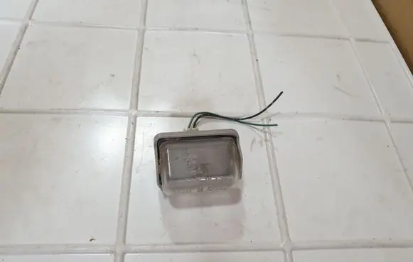 Mazda 6 Number plate light 13061971