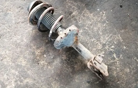 Subaru Outback Front shock absorber with coil spring