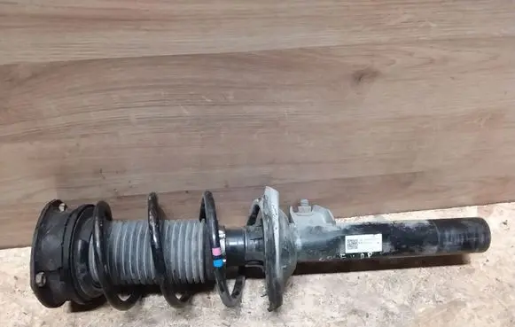 Volkswagen Golf VII Front shock absorber with coil spring 5Q0413023FH