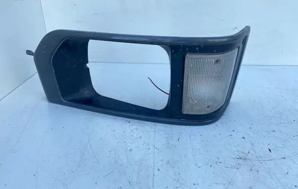 Isuzu Midi Under headlight/headlamp trim 21221394