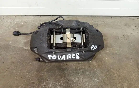 Volkswagen Touareg II Front brake caliper 7P6615106AE