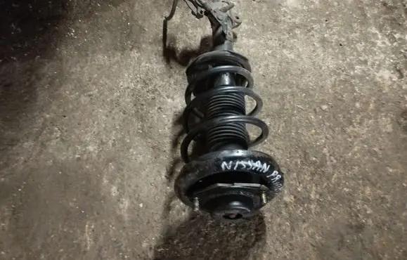 Nissan Primera Front shock absorber with coil spring