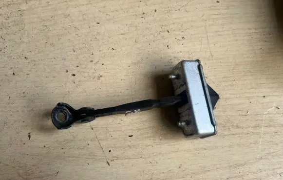 Mazda 6 Rear door check strap stopper