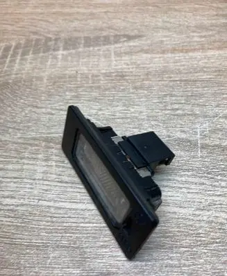 Volkswagen PASSAT B6 Number plate light 8T0943021