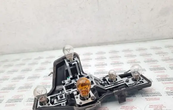Tail light bulb cover holder