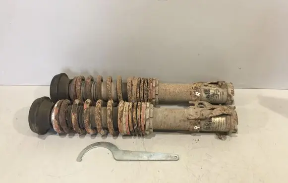Volkswagen Golf II Front shock absorber with coil spring 48034521 480345211 4803452