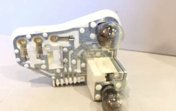 Tail light bulb cover holder