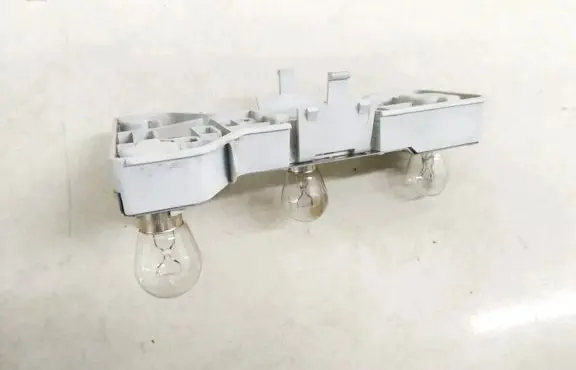 Tail light bulb cover holder