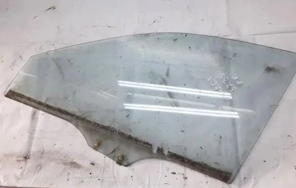 Mazda 323 Front door window glass four-door