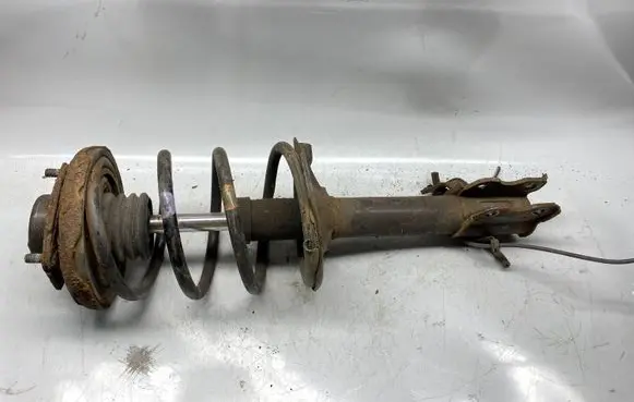 Nissan X-Trail T31 Front shock absorber with coil spring