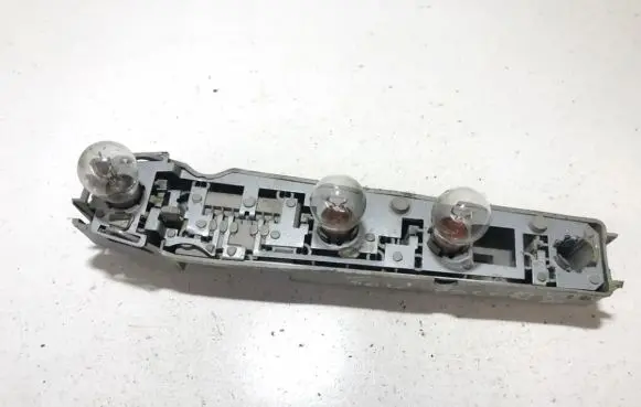 Tail light bulb cover holder