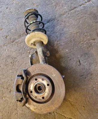 Front wheel hub spindle knuckle