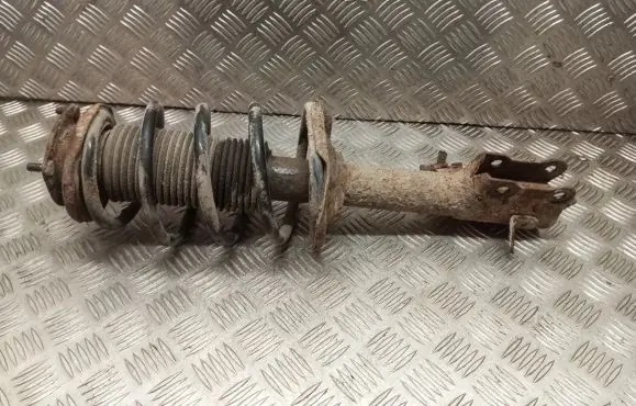 Nissan Almera N16 Front shock absorber with coil spring
