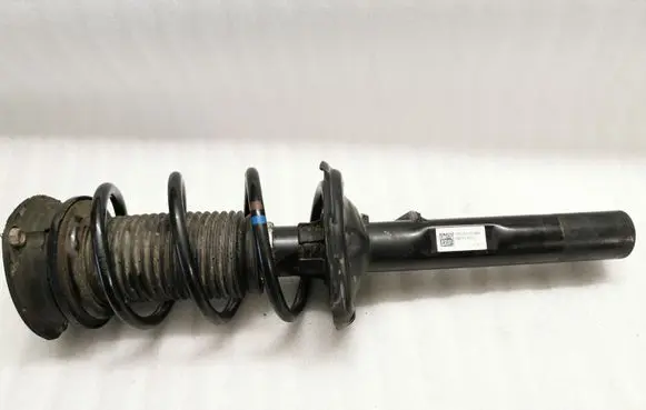 Volkswagen Golf VII Front shock absorber with coil spring 5Q0413023FJ