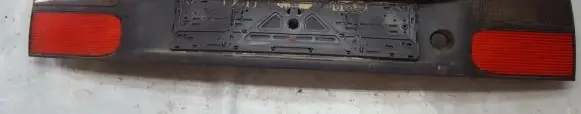Renault Laguna I Trunk door license plate light bar 7700820049