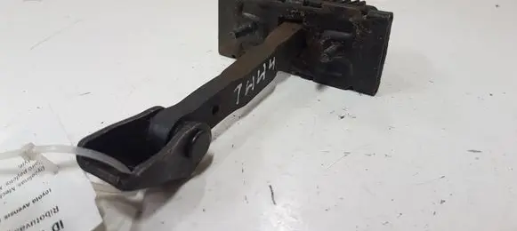 Front door check strap stopper