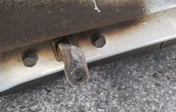Front door check strap stopper