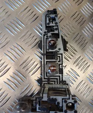 Tail light bulb cover holder