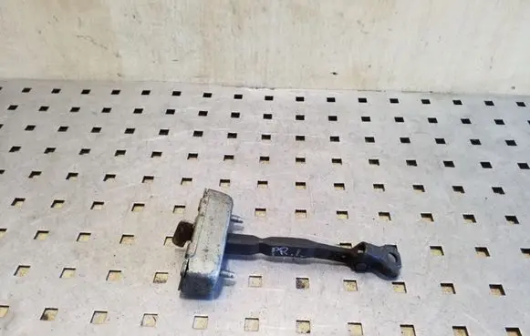 Front door check strap stopper