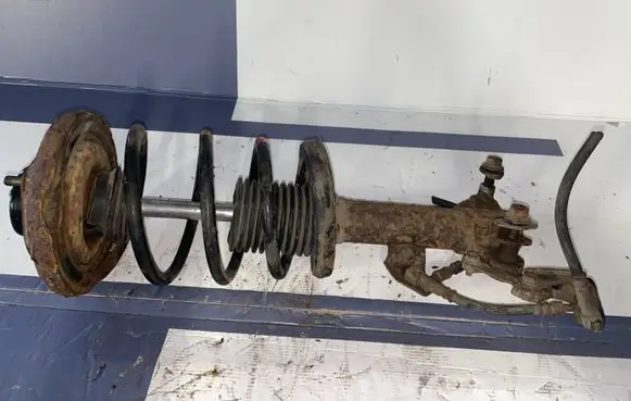 Nissan Primera Front shock absorber with coil spring