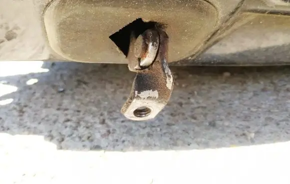 Front door check strap stopper