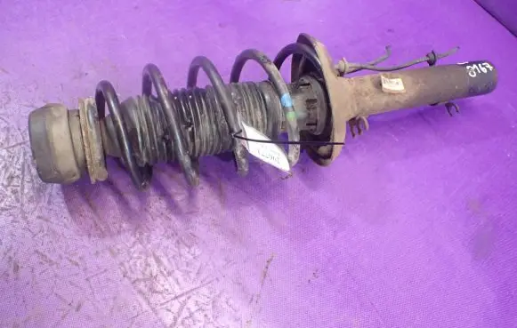 Volkswagen Golf IV Front shock absorber with coil spring 1J0413031S
