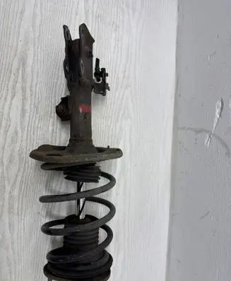 Front shock absorber with coil spring