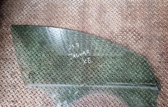 Jaguar XE Front door window glass four-door