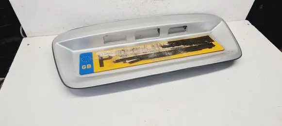 Trunk door license plate light bar