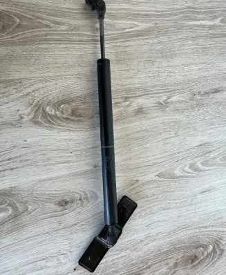 Front door check strap stopper