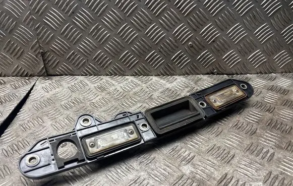 Volkswagen Jetta V Trunk door license plate light bar 1T0827574B