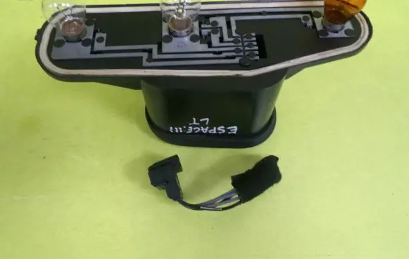 Tail light bulb cover holder