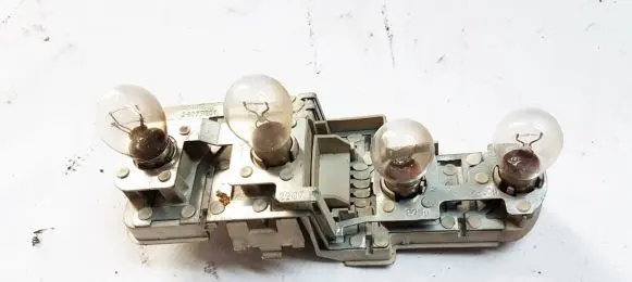 Tail light bulb cover holder