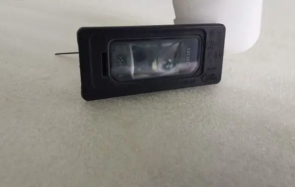 Jaguar E-Pace Number plate light GX7313B627AB 0122352KA