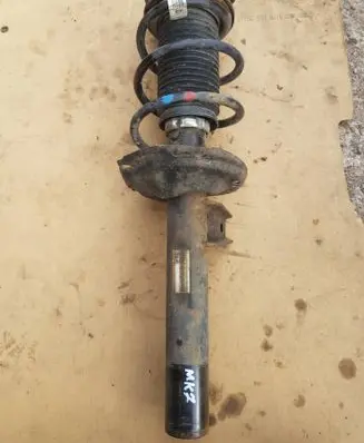 Volkswagen Golf VII Front shock absorber with coil spring 5Q0413023FH