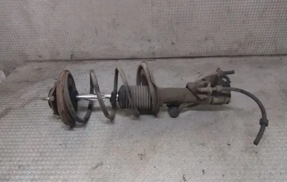 Mitsubishi Lancer VIII Front shock absorber with coil spring