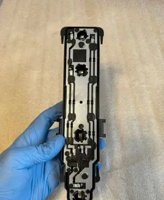 Tail light bulb cover holder