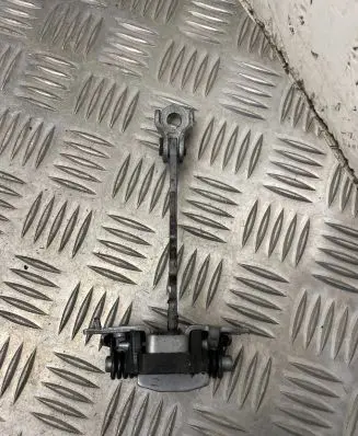Front door check strap stopper