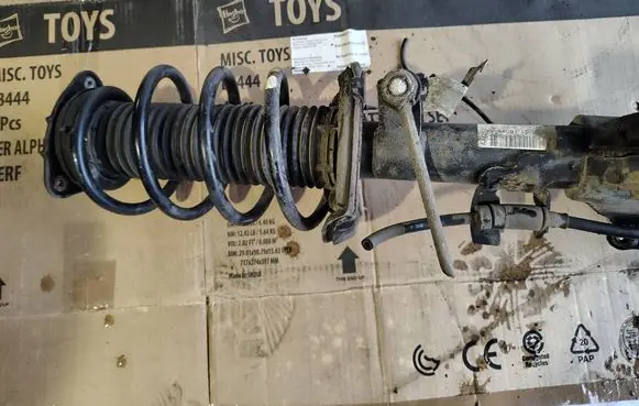 Front shock absorber with coil spring
