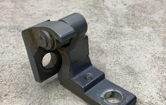Rear door upper hinge
