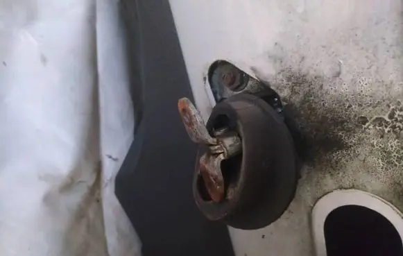 Front door check strap stopper