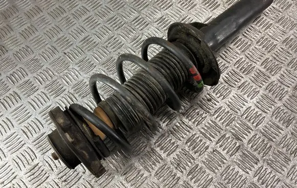 Volkswagen Caddy Front shock absorber with coil spring