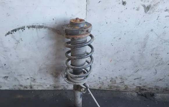 Volkswagen Caddy Front shock absorber with coil spring