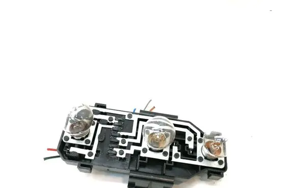Tail light bulb cover holder
