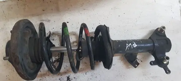 Nissan Primera Front shock absorber with coil spring