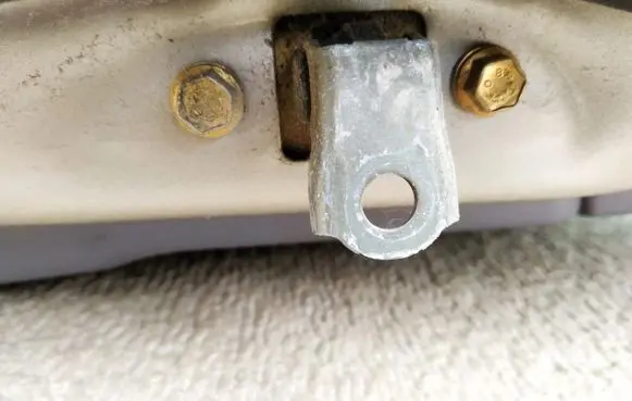 Front door check strap stopper