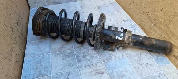 Volkswagen Fox Front shock absorber with coil spring 5Z0413031C