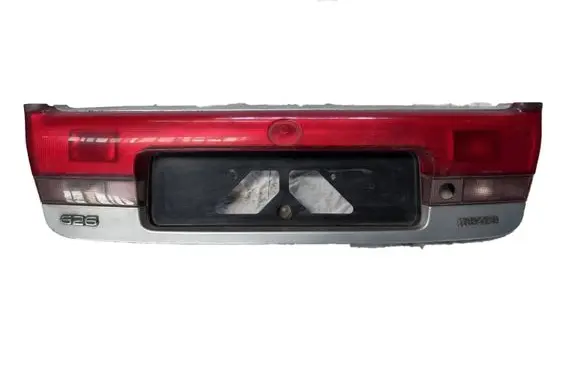 Mazda 626 Trunk door license plate light bar 0431394