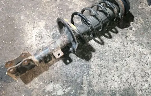 Suzuki Swift I Front shock absorber with coil spring 4160162J32