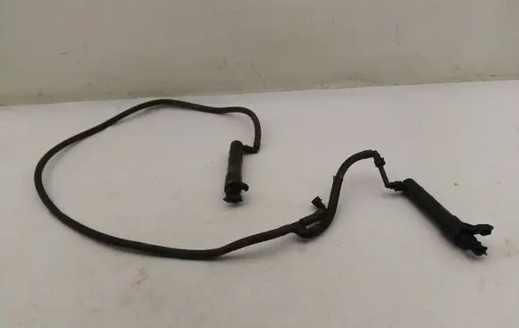 Volkswagen Golf V Headlight washer spray nozzle